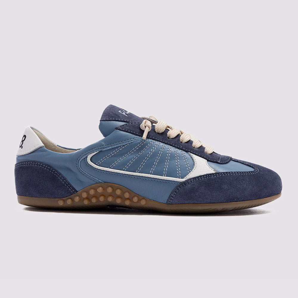 A sleek P448 Lisbon sneaker in a tonal blue palette, combining premium suede and leather with vintage-inspired stitching and a unique textured gum sole.