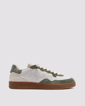 Side angle of white and green sneakers