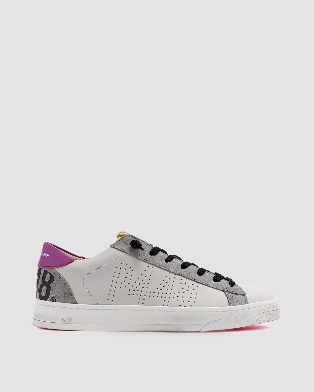Side angle of white, pink and yellowsneakers